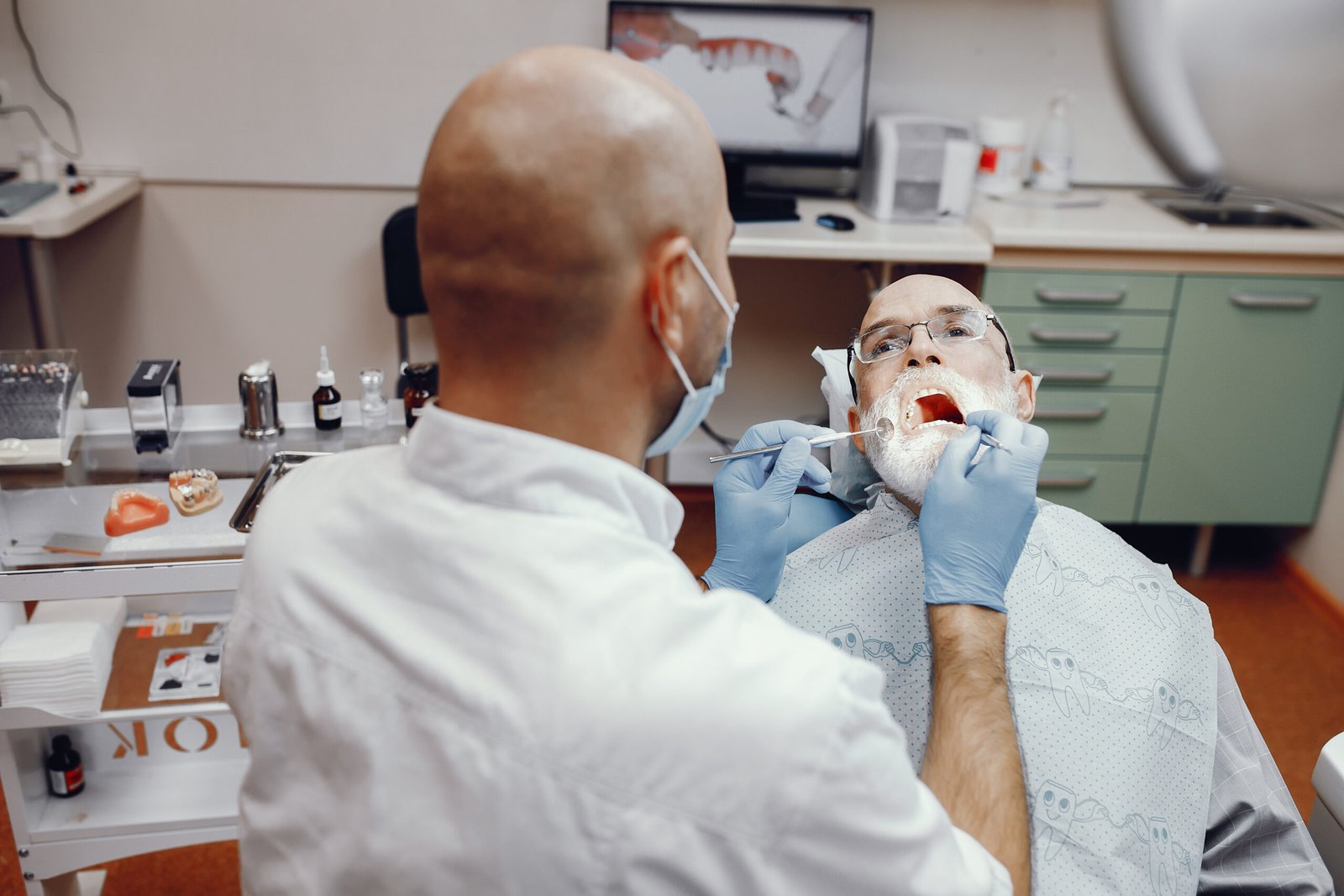 old man sitting in the dentist
